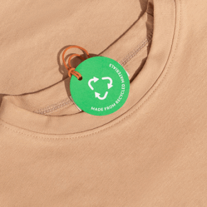 Beige shirt with recycled material tag.