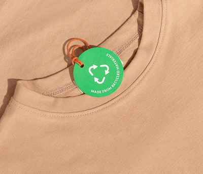 Beige shirt with recycled material tag.